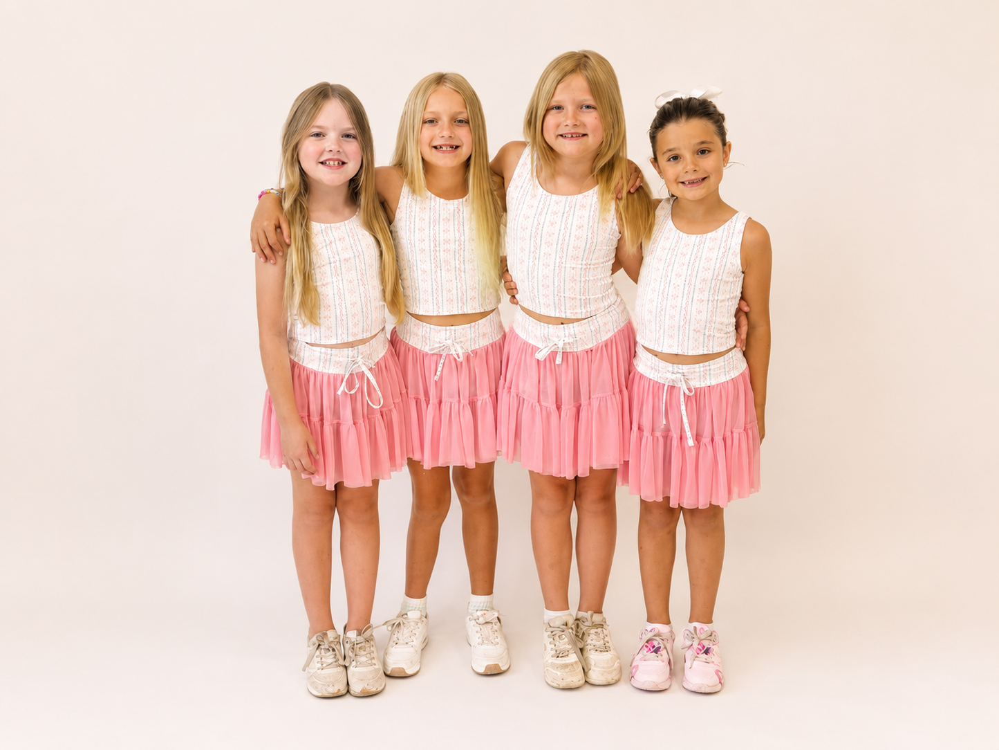 Pink obverlay skirts with bow printed detail