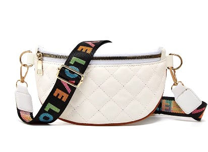 A white kid's quilted faux leather crossbody bag with a multicolored 'LOVE' text strap.