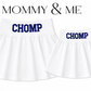 Two white pleated skirts shown on a white background, labeled 'MOMMY & ME' at the top. The larger skirt says 'CHOMP' in blue and the smaller skirt says 'CHOMP' as well. For Florida. 